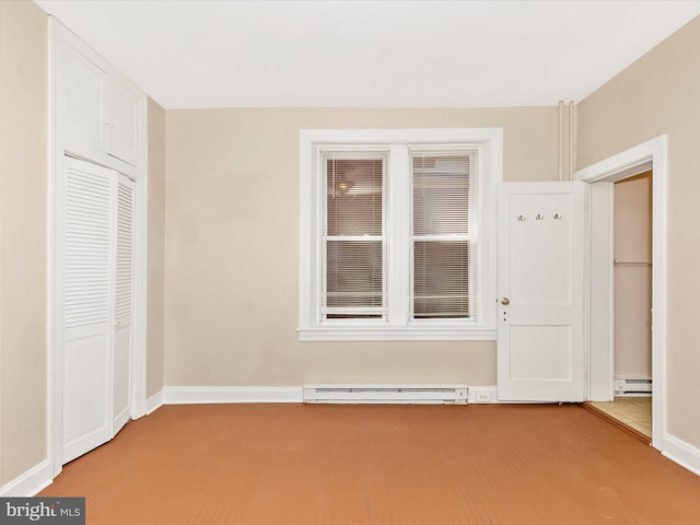 unfurnished bedroom featuring a closet, light colored carpet, and a baseboard radiator