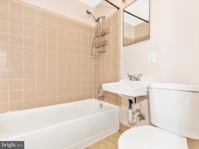 full bath featuring tile patterned floors, toilet, and bathing tub / shower combination