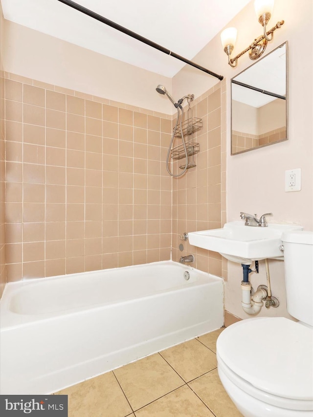 bathroom featuring toilet, shower / tub combination, and tile patterned flooring