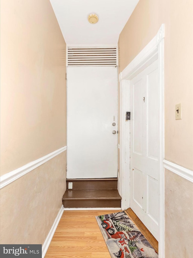 doorway to outside with wood finished floors