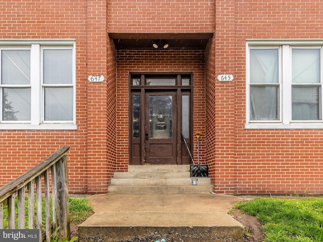 entrance to property with brick siding