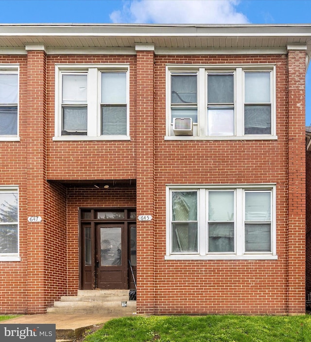 view of front of property featuring brick siding and entry steps