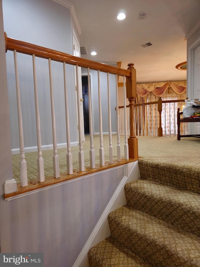 staircase with visible vents, recessed lighting, and carpet