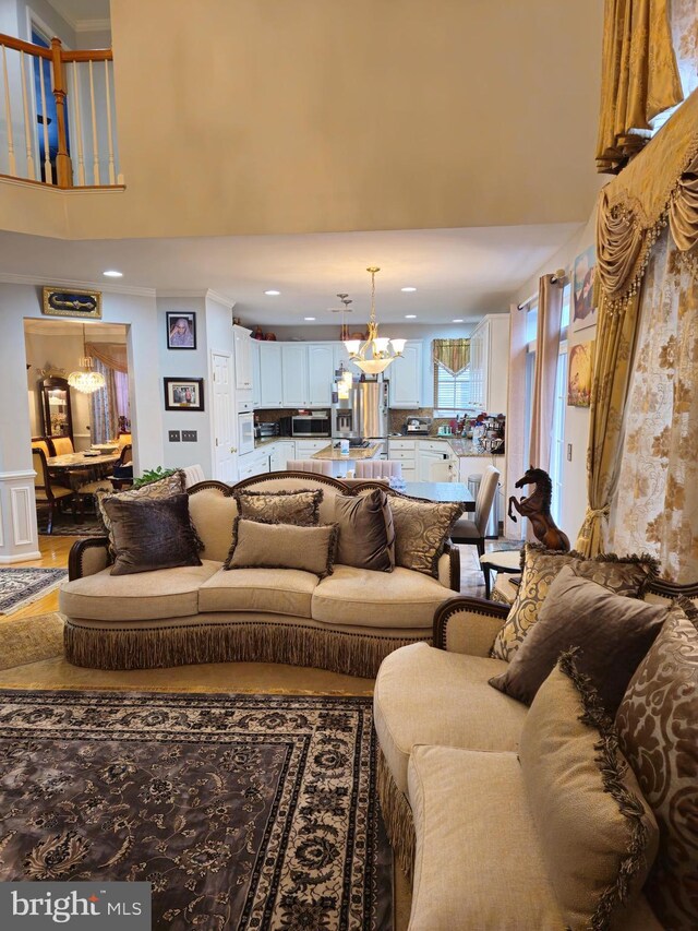 314 Senate Ct, Herndon, VA 20170 - living area featuring a chandelier, recessed lighting, a towering ceiling, and crown molding