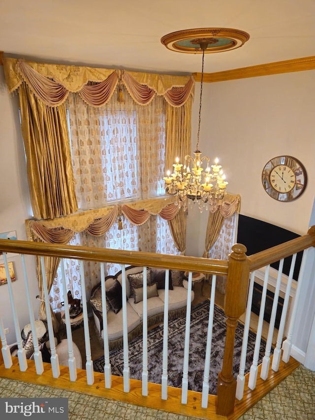 interior space featuring crown molding and an inviting chandelier