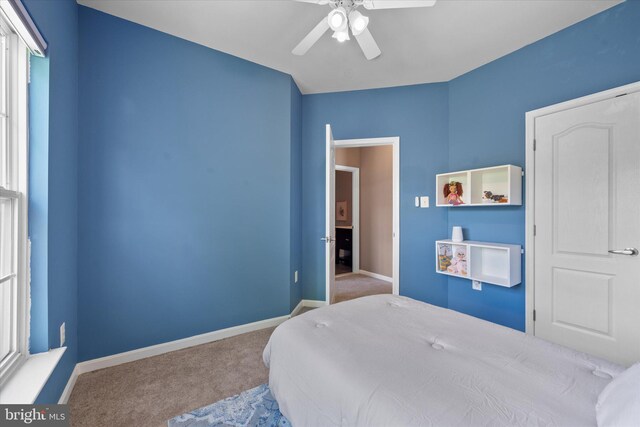 bedroom with carpet flooring, baseboards, and ceiling fan