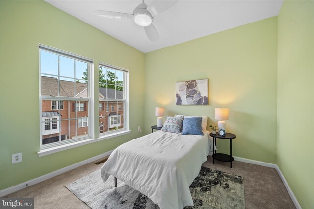 bedroom with carpet, baseboards, and a ceiling fan