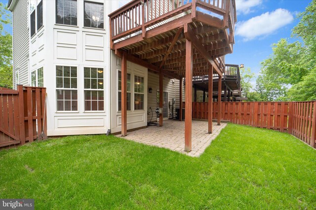 view of yard featuring a wooden deck, a patio, and stairway