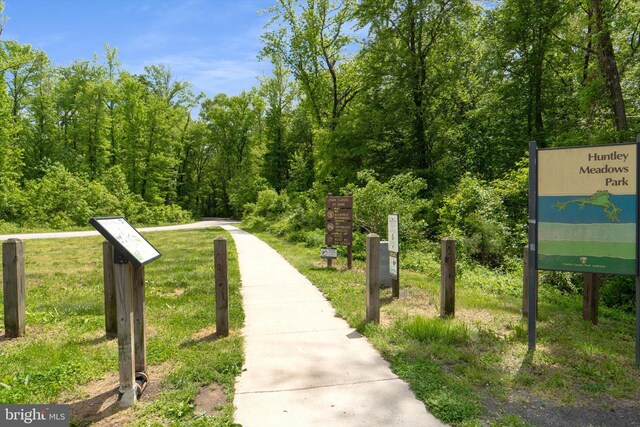 view of property's community featuring a forest view