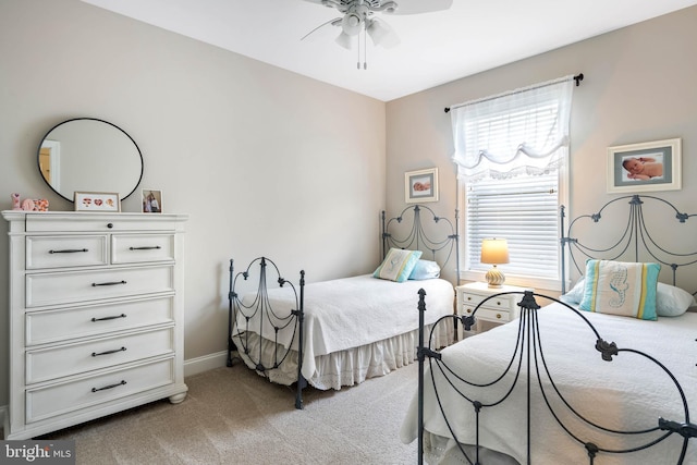 bedroom with baseboards, a ceiling fan, and light colored carpet