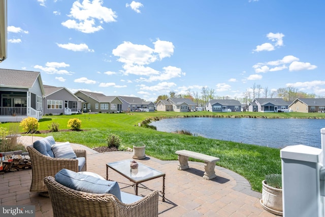 view of patio with a water view and a residential view
