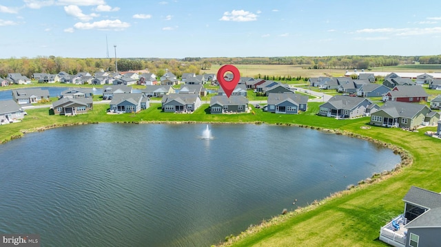 birds eye view of property with a residential view and a water view