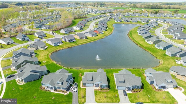 bird's eye view featuring a water view and a residential view