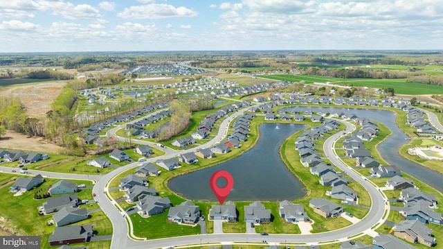 bird's eye view with a residential view and a water view