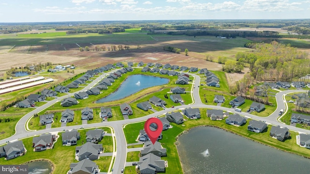 birds eye view of property with a residential view and a water view