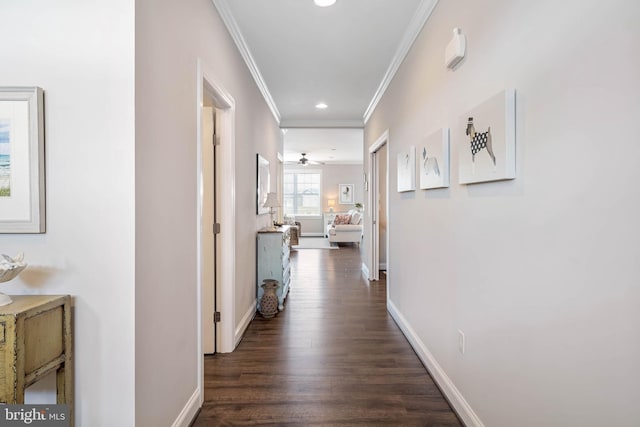 corridor featuring baseboards, recessed lighting, dark wood finished floors, and crown molding