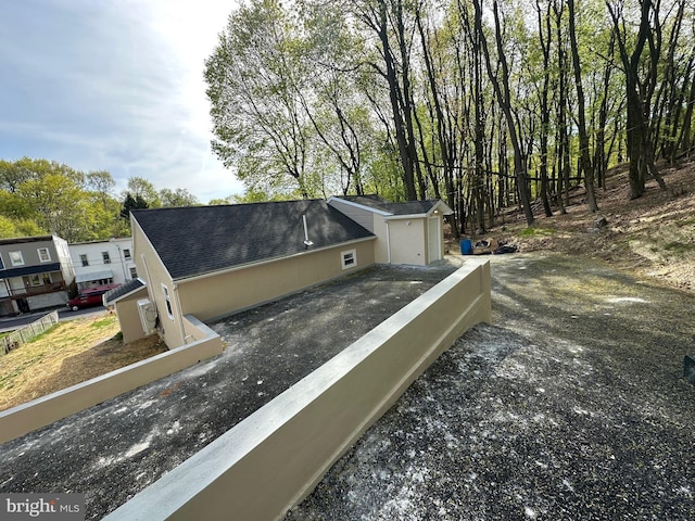 607 N 8th St, Pottsville, PA 17901 - exterior details featuring a shingled roof and driveway