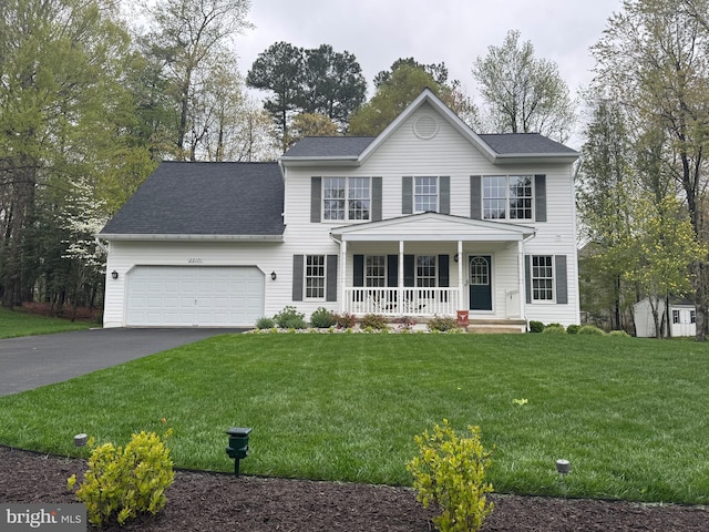 view of front of home featuring a porch, a front yard, a garage, aphalt driveway, and a shingled roof
