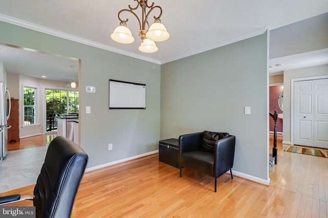 office area with crown molding, baseboards, a chandelier, and light wood-style flooring