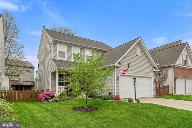view of front of property featuring a shingled roof, fence, a front yard, and concrete driveway
