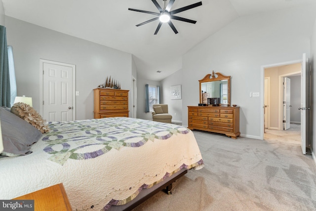 bedroom featuring baseboards, ceiling fan, light carpet, and lofted ceiling