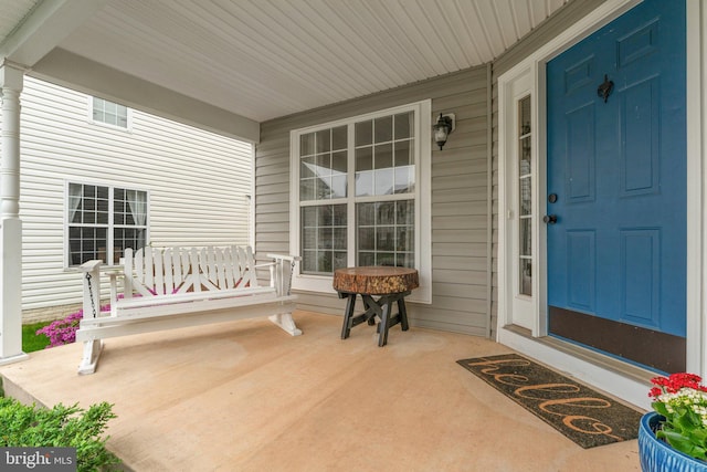 doorway to property with a porch