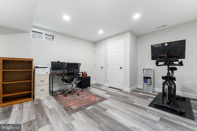 office area featuring recessed lighting, baseboards, visible vents, and wood finished floors