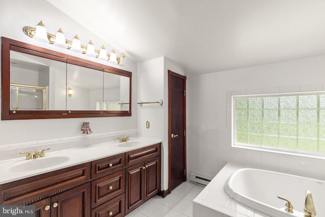 full bathroom featuring a sink, double vanity, a baseboard heating unit, and a garden tub