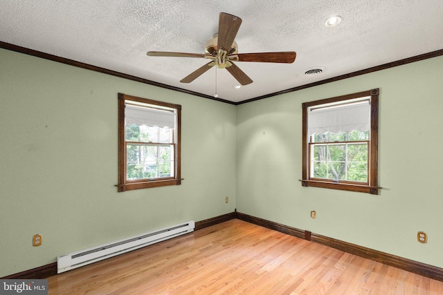 unfurnished room with crown molding, a ceiling fan, light wood-style floors, baseboards, and a baseboard radiator