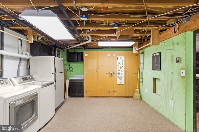 washroom with light colored carpet and washing machine and dryer