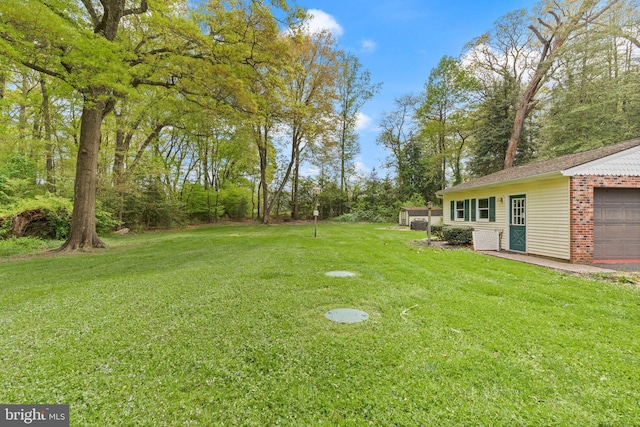 view of yard with a garage