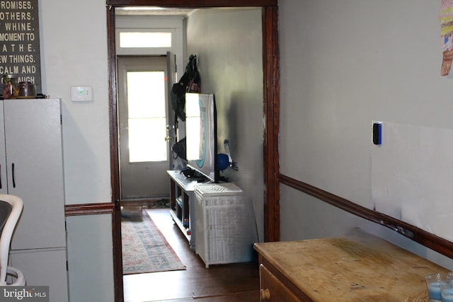 interior space featuring dark wood-type flooring and a healthy amount of sunlight