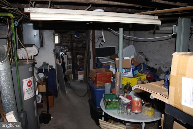 unfinished basement with electric water heater