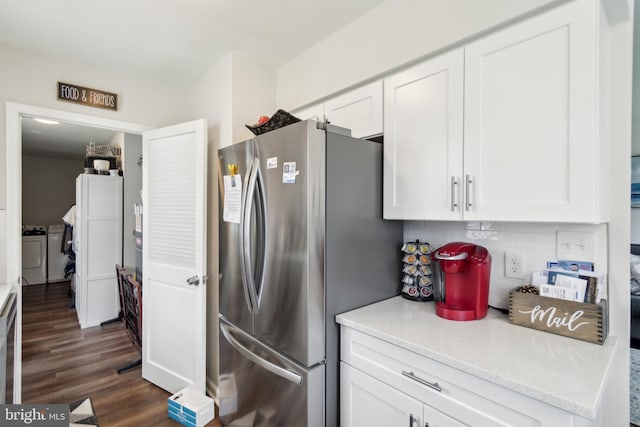 617 Franklin Ave, Cherry Hill, NJ 08002 - kitchen featuring tasteful backsplash, washer and clothes dryer, dark wood finished floors, white cabinetry, and freestanding refrigerator