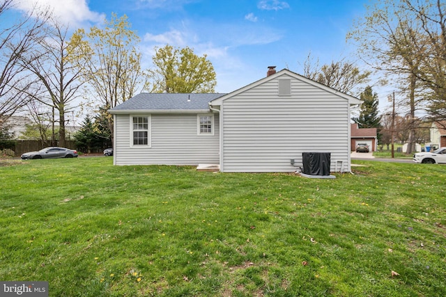 617 Franklin Ave, Cherry Hill, NJ 08002 - rear view of house featuring a chimney, roof with shingles, and a yard