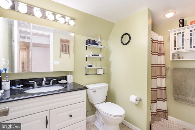 bathroom featuring toilet, vanity, baseboards, and a shower with curtain
