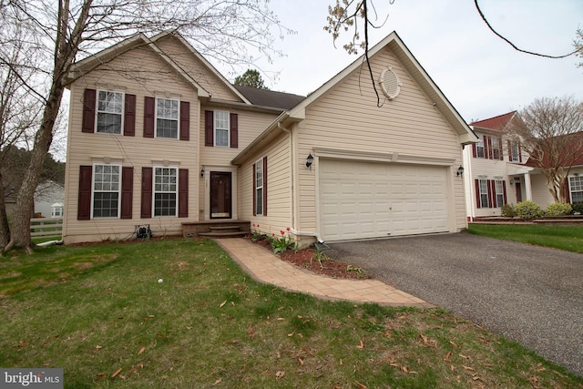 traditional home with an attached garage, fence, driveway, and a front lawn