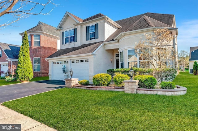 14 Goddard Dr, Cranbury, NJ 08512 - traditional home with driveway, stucco siding, an attached garage, a front lawn, and roof with shingles