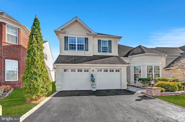 14 Goddard Dr, Cranbury, NJ 08512 - traditional home with stucco siding, asphalt driveway, a garage, and a shingled roof