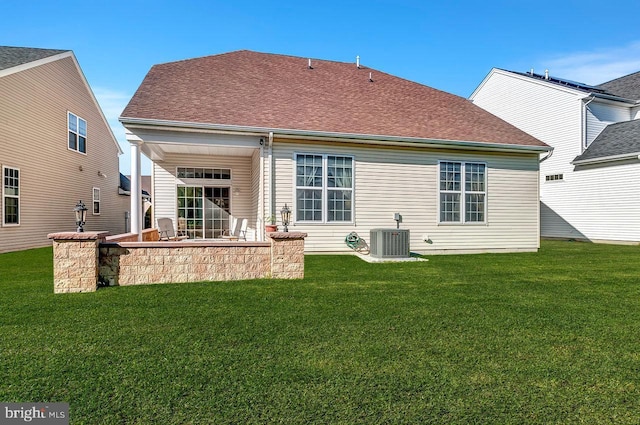 14 Goddard Dr, Cranbury, NJ 08512 - rear view of property featuring a yard, cooling unit, and a shingled roof