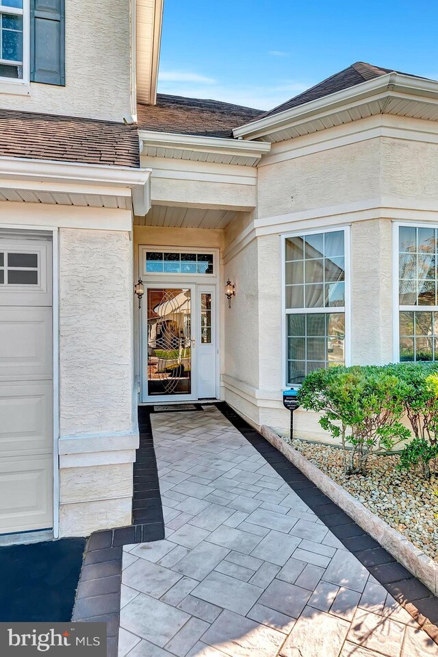 14 Goddard Dr, Cranbury, NJ 08512 - doorway to property featuring stucco siding