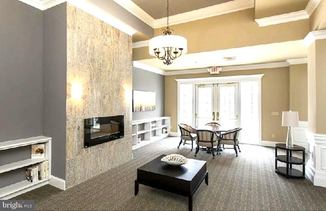 14 Goddard Dr, Cranbury, NJ 08512 - living area with crown molding, a multi sided fireplace, dark carpet, a chandelier, and baseboards