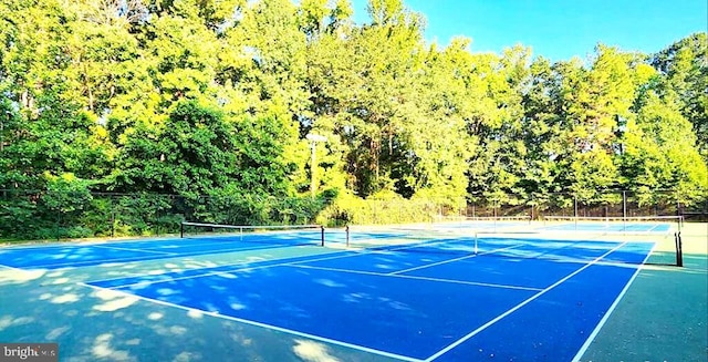 14 Goddard Dr, Cranbury, NJ 08512 - view of tennis court with a wooded view