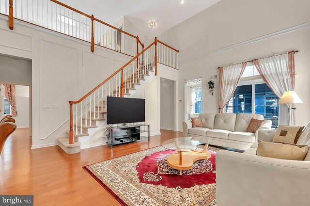 14 Goddard Dr, Cranbury, NJ 08512 - living room featuring a high ceiling, wood finished floors, and stairs