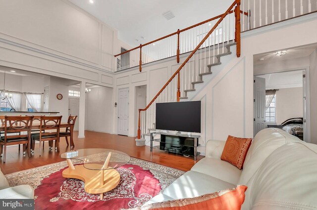 14 Goddard Dr, Cranbury, NJ 08512 - living room featuring a high ceiling, wood finished floors, and stairway