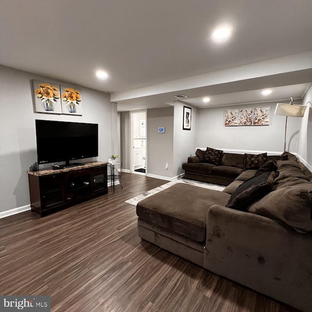 living room featuring baseboards, recessed lighting, and dark wood-style floors