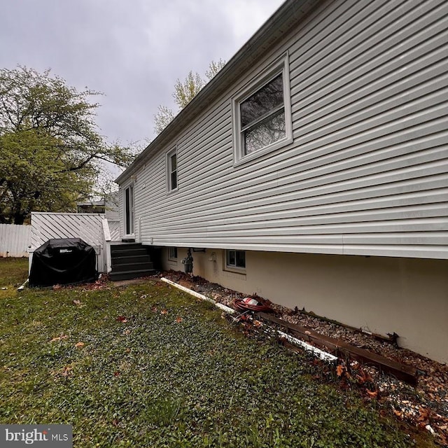 view of property exterior with fence