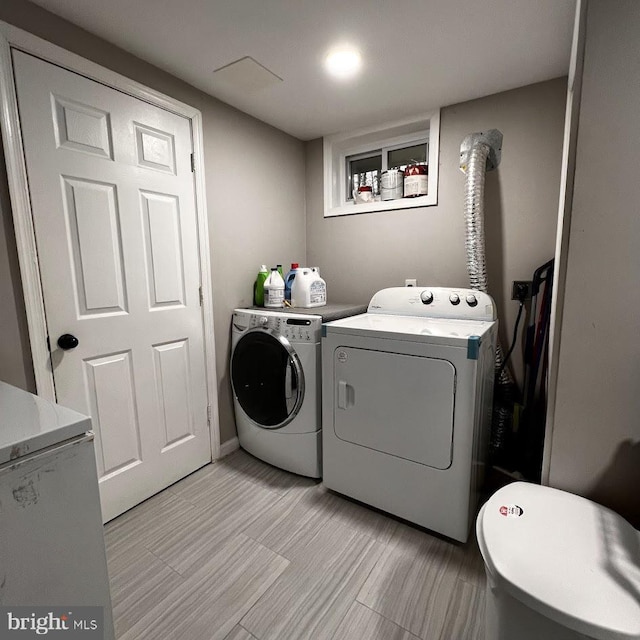 laundry room featuring independent washer and dryer and laundry area
