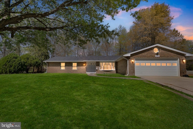 3600 Yorktown Dr, Waldorf, MD 20601 - ranch-style house featuring a yard, concrete driveway, a garage, and brick siding