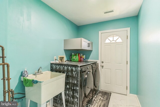 3600 Yorktown Dr, Waldorf, MD 20601 - laundry area featuring visible vents, a sink, independent washer and dryer, cabinet space, and marble finish floor